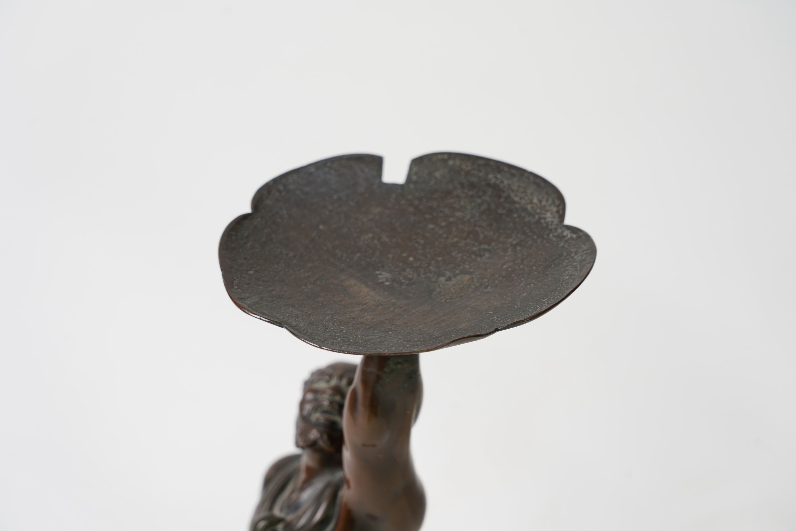 A Japanese bronze figure of an Oni holding a temple bell aloft, Meiji period, in Miyao style